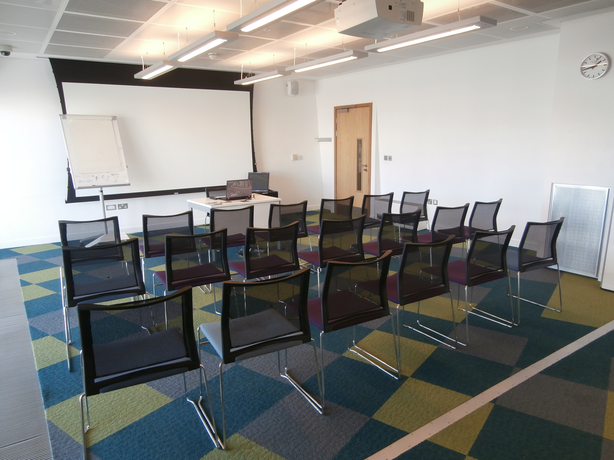 Alt tag: Modern Meeting Room 2 in Canada Water Library with focused seating for presentations.