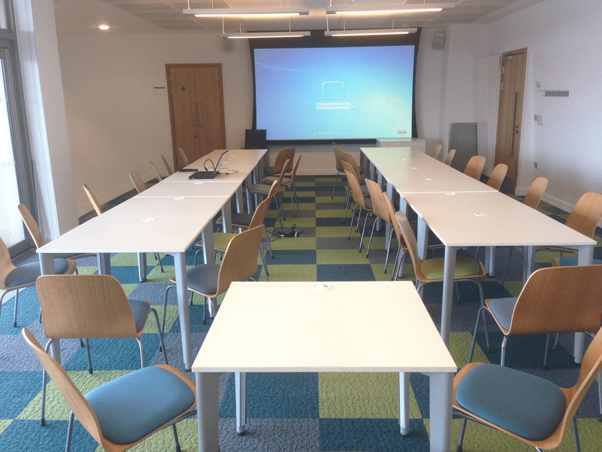 Meeting Room 3 at Canada Water Library, U-shaped setup for collaborative sessions.