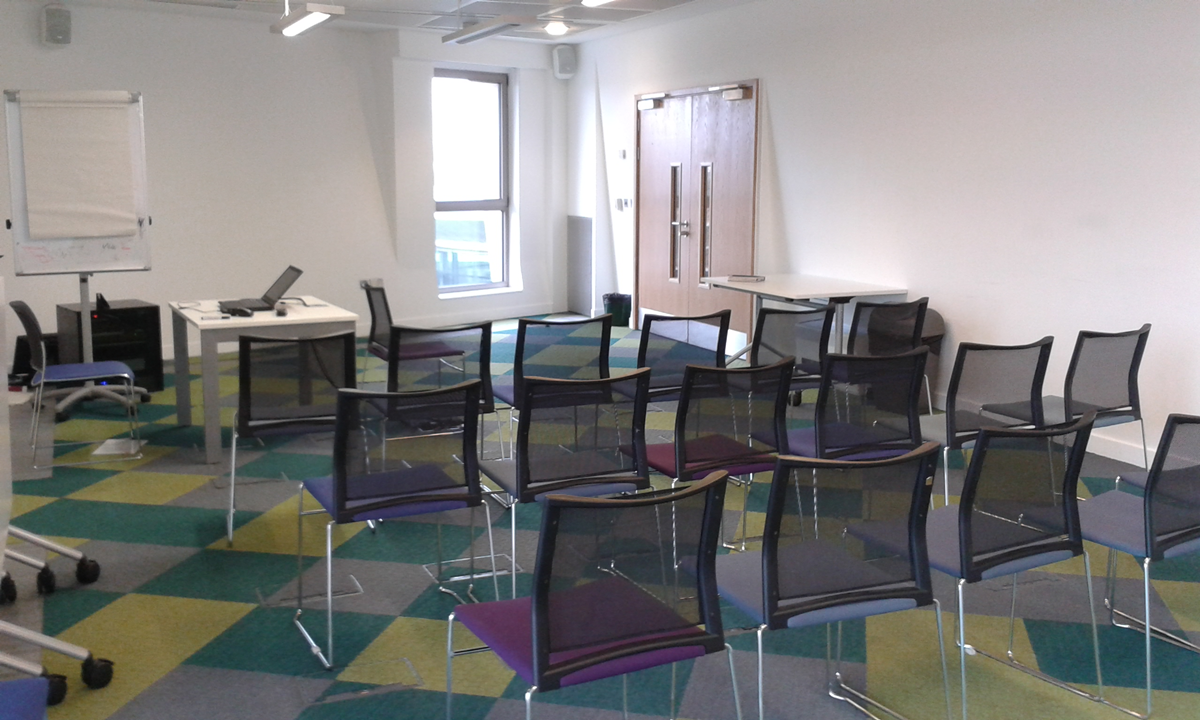 Meeting Room 6 at Canada Water Library, featuring transparent chairs for workshops.