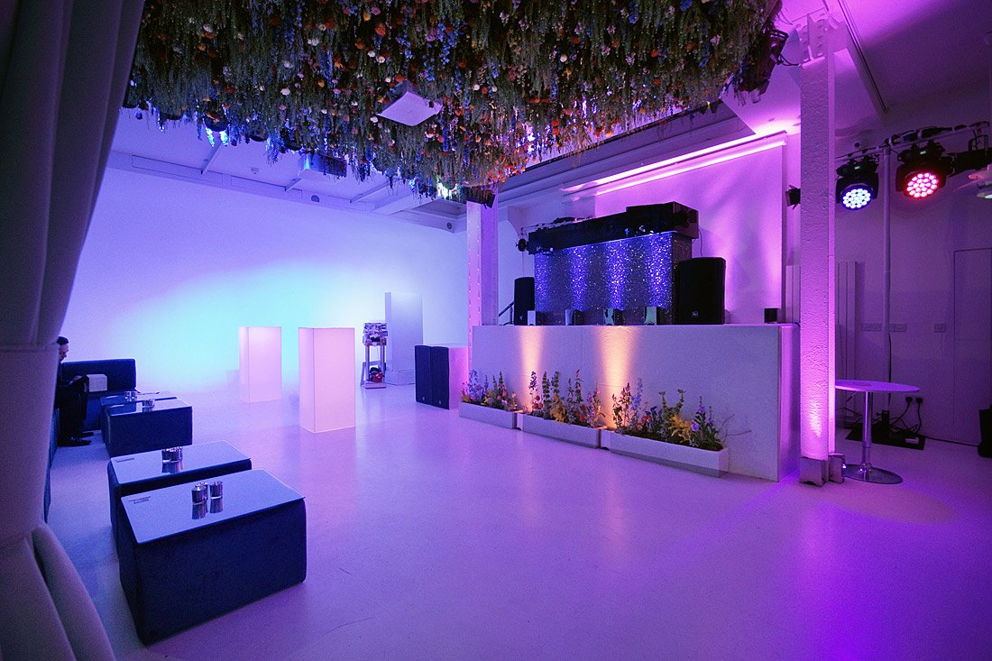 Modern event space with ambient lighting for corporate and social drink receptions.