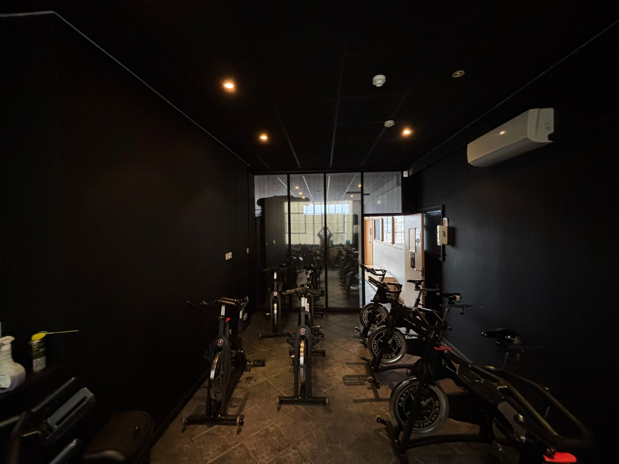 Modern fitness studio with stationary bikes for wellness events and team-building activities.