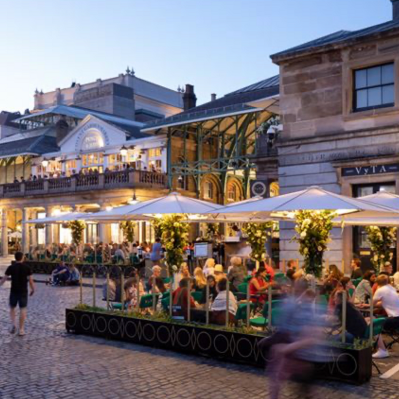 Vibrant outdoor cocktail bar in VyTA Covent Garden, ideal for summer events and gatherings.