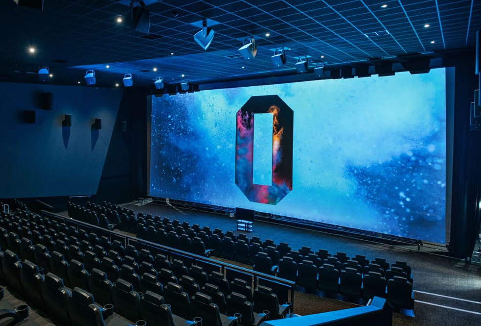 Modern event space at ODEON Manchester with large screen for corporate meetings and presentations.