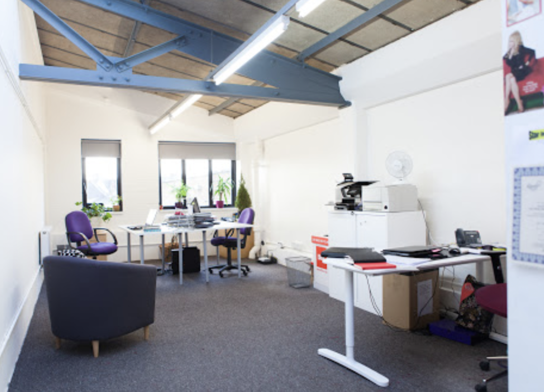 Modern minimalist event space in Tooting Works, perfect for meetings and brainstorming.