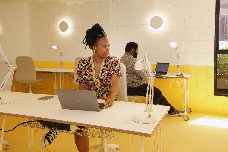 Modern event space in Tooting Works with bright yellow accents for workshops and meetings.