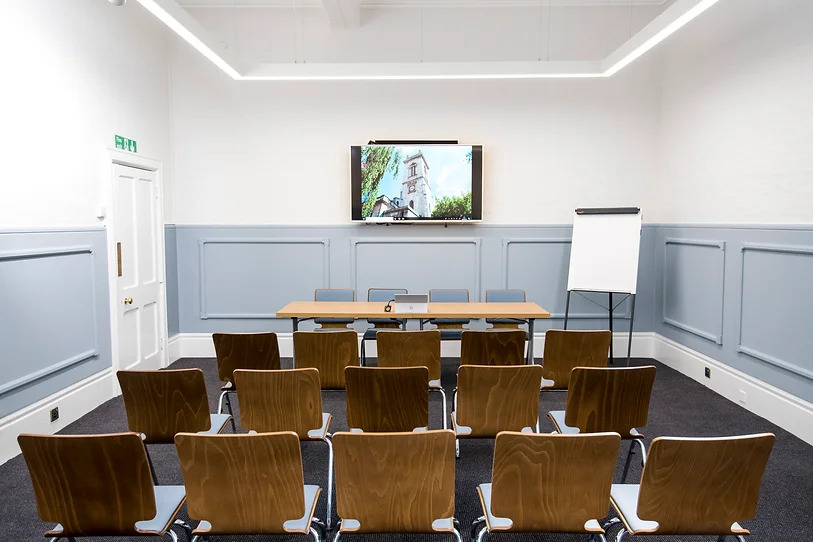 Holborn Venues meeting room with central table, ideal for workshops and team meetings.