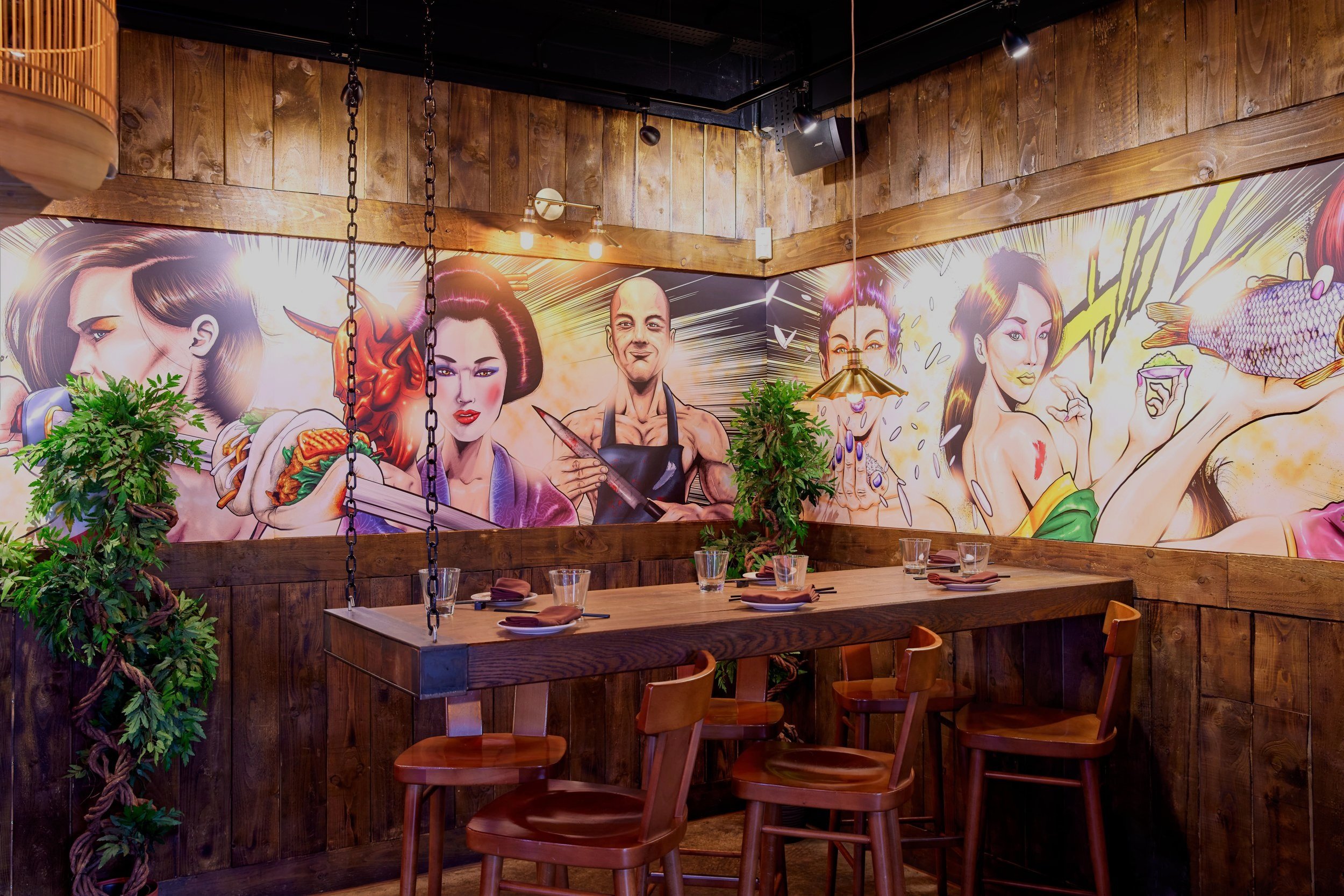 Outdoor terrace at Yuu Kitchen with vibrant mural art, perfect for team-building events.
