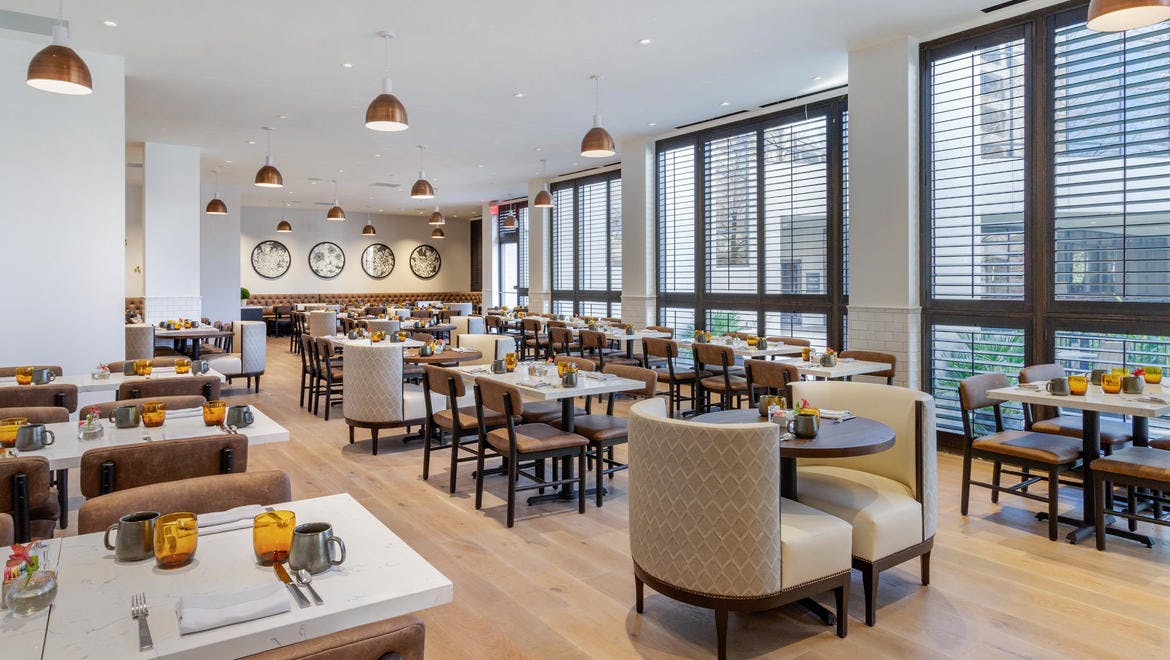 Modern dining space at Omni Houston Hotel, ideal for meetings and events.