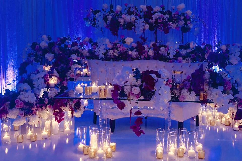 Elegant Constellation Ballroom with floral backdrop, perfect for weddings and upscale events.