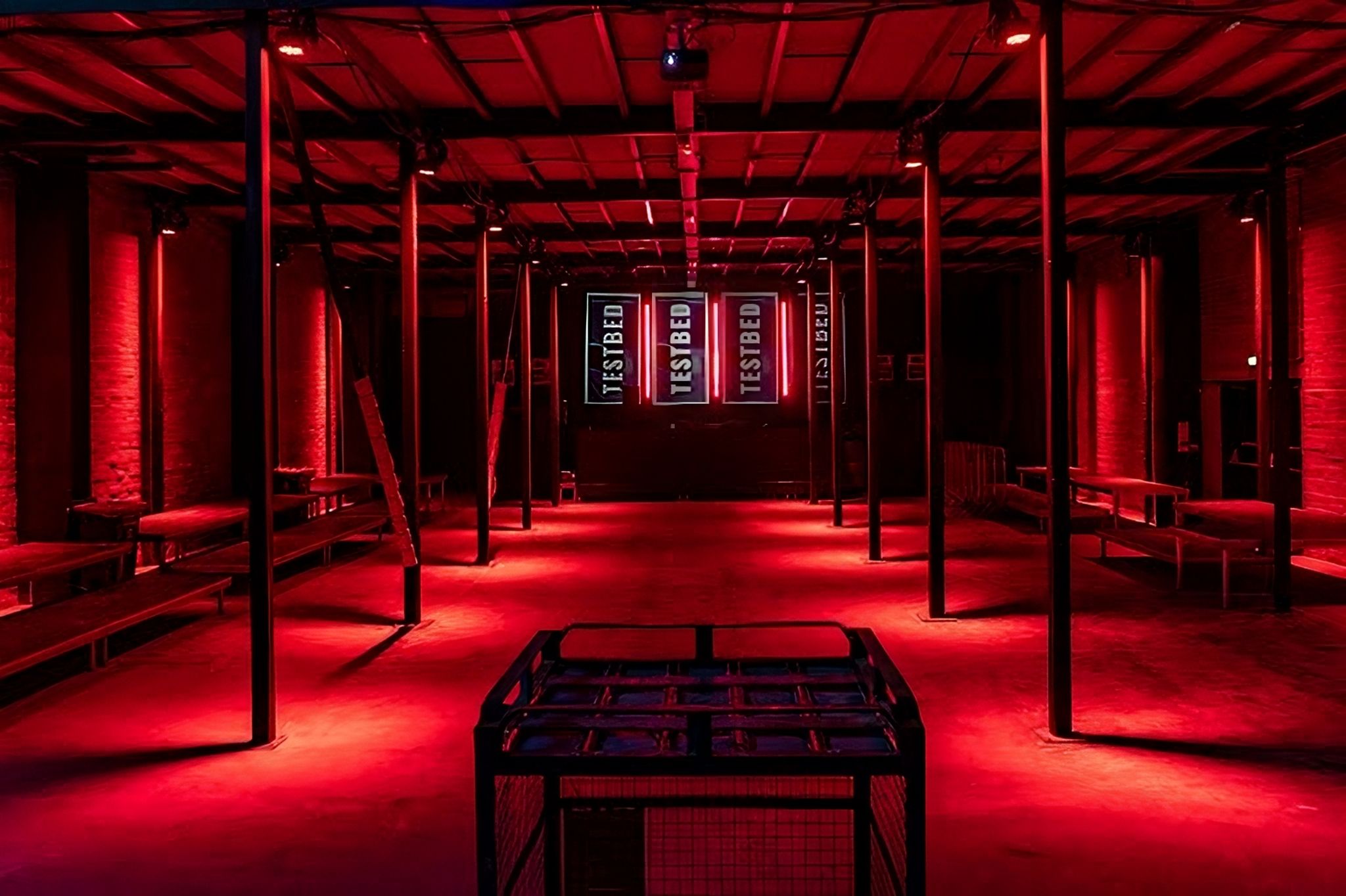 Live music venue in TESTBED with red lighting, ideal for product launches and creative events.