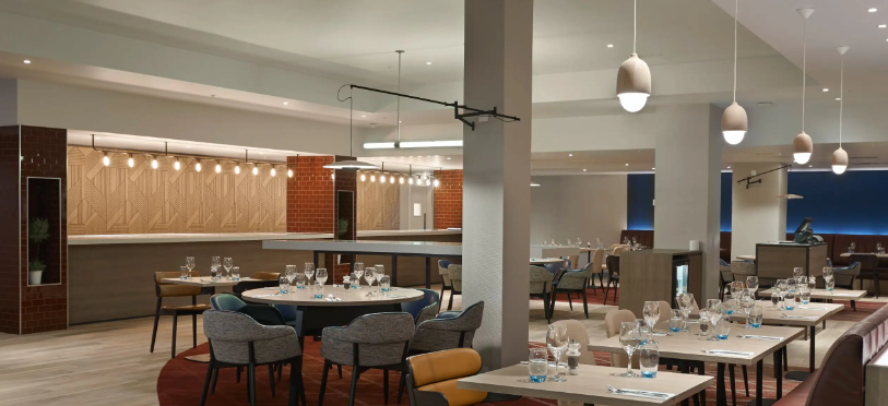 Modern dining space at Hyatt Place Heathrow, ideal for meetings and networking events.