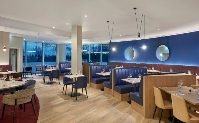 Modern dining space at Hyatt Place Heathrow, ideal for meetings and events.