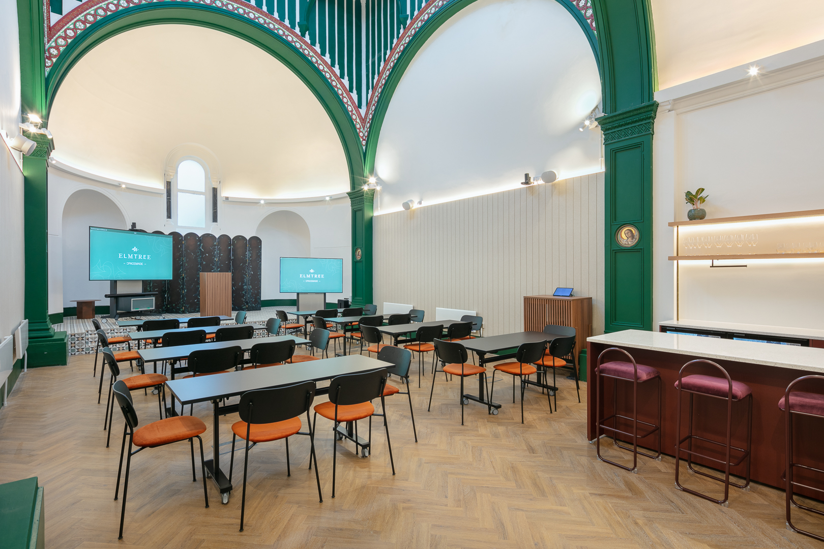 Versatile event space with modern design, ideal for networking and presentations.