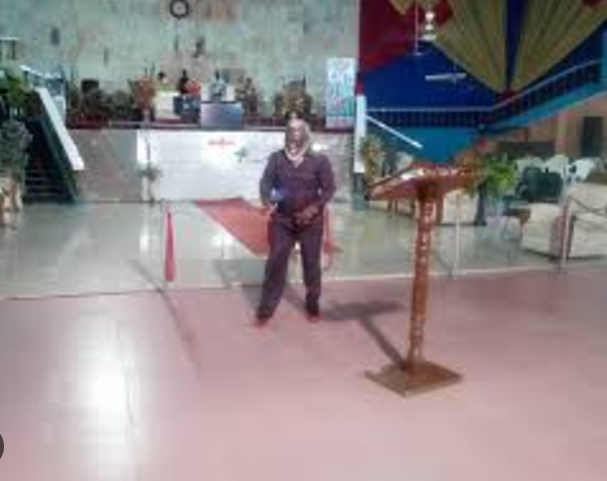 Spacious event venue with stage and podium at Redeemed Pillar of Fire Ministry, London.