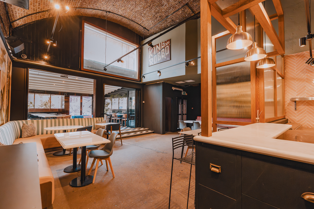 Industrial event venue, natural light, networking, cocktail party