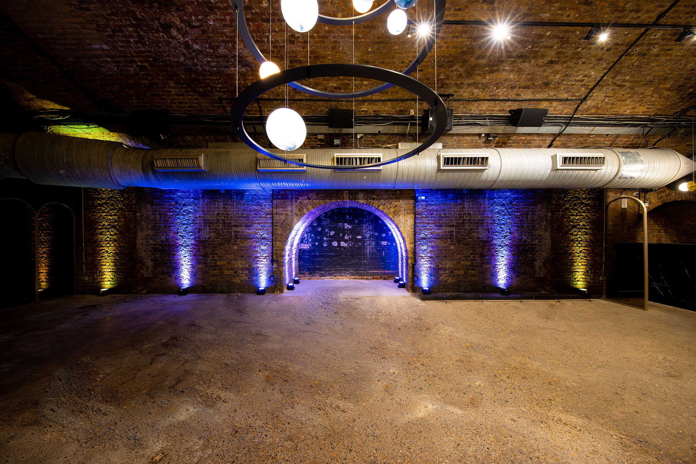 Versatile event space with exposed brick walls at Whole Venue, 83 Rivington Street.