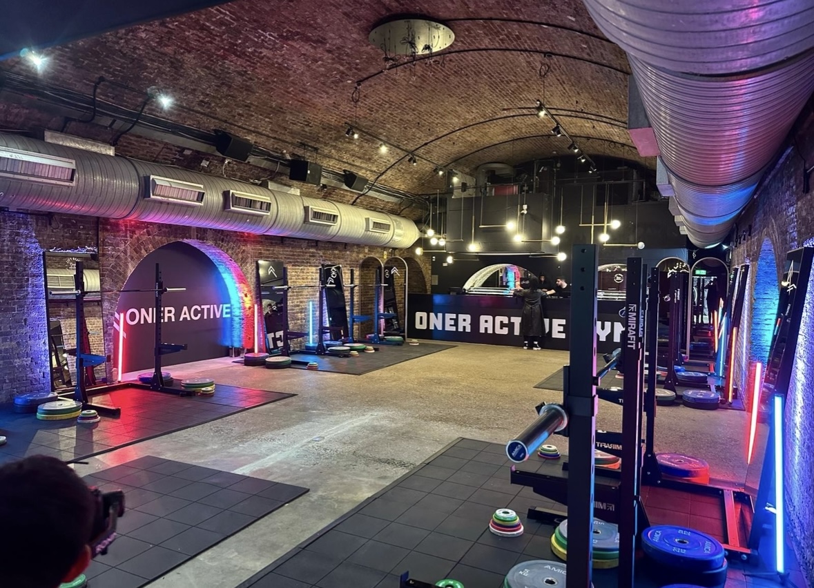 Modern fitness venue with exposed brick, ideal for wellness retreats and corporate events.