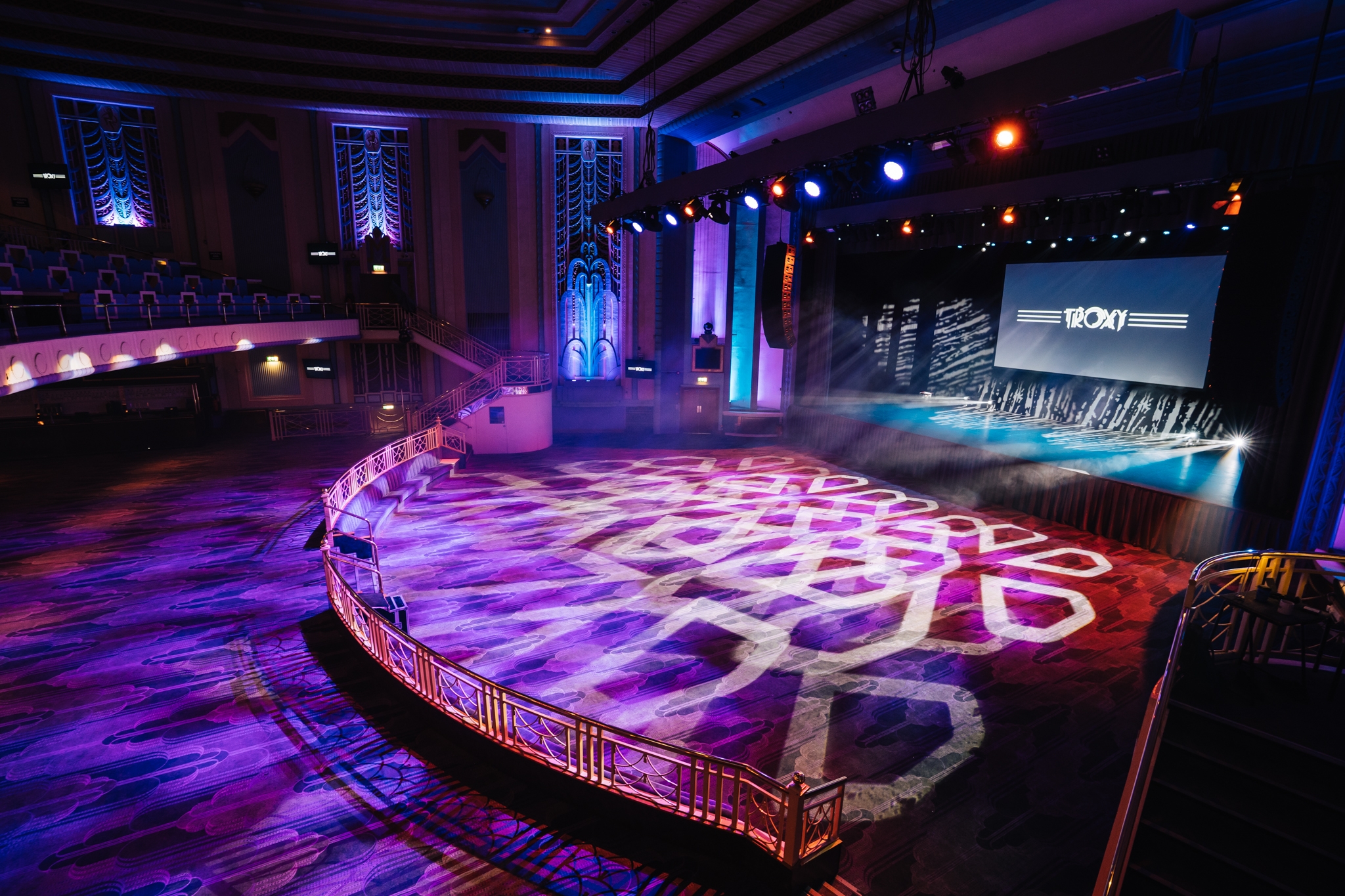 Grand Hall at Troxy with stage lighting, perfect for events and presentations.