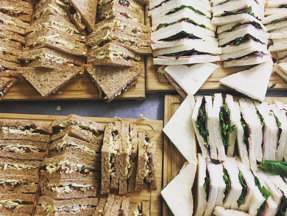 Sandwich platters on wooden boards at Moat Terrace, ideal for corporate events.
