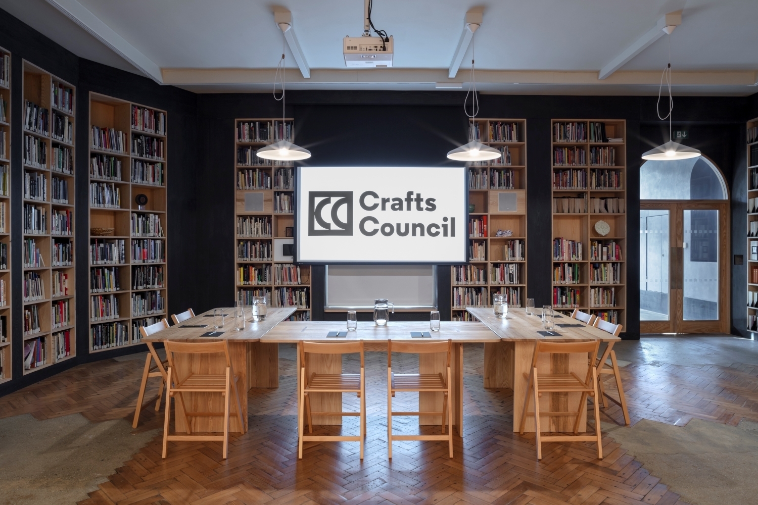 Crafts Council Gallery meeting space with wooden table for workshops and presentations.
