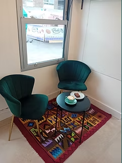 Cozy HAVEN Coffee venue with green chairs, perfect for meetings and brainstorming sessions.