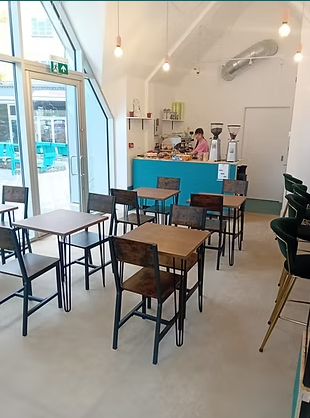 Cozy HAVEN Coffee venue with natural light, perfect for networking events and gatherings.