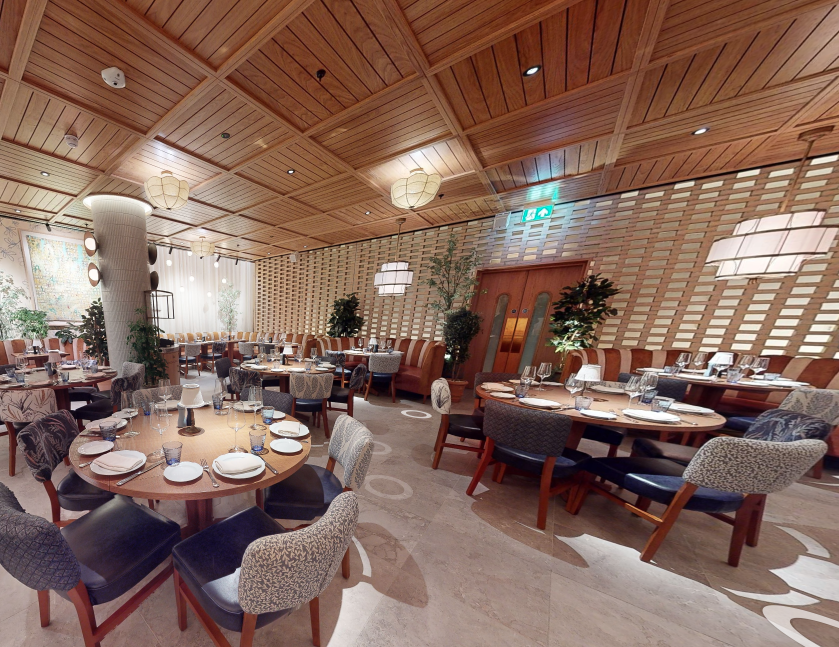 Stylish restaurant with warm wood tones, ideal for meetings and events at The BoTree.