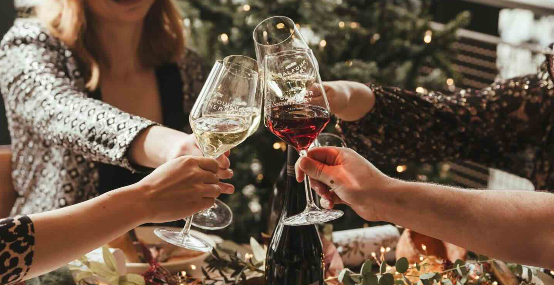 Celebratory toast with elegant glassware at Balfour At Bow Wine Vaults event.