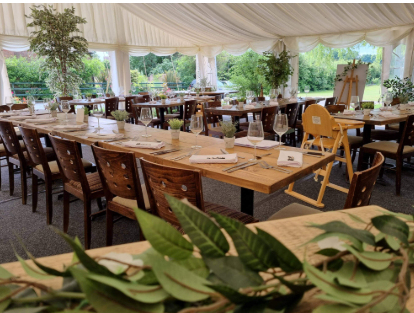 Elegant dining setup in marquee at The White Hart Flitton for events and celebrations.