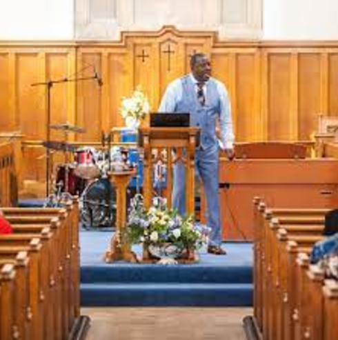 Speaker addressing audience in Potters House Wembley, ideal for community events and gatherings.