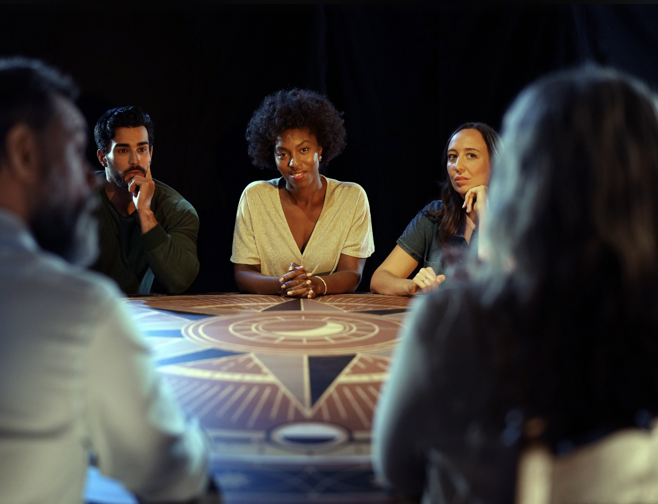 Diverse group in warm-lit Mezzanine Full hire for strategic planning session.