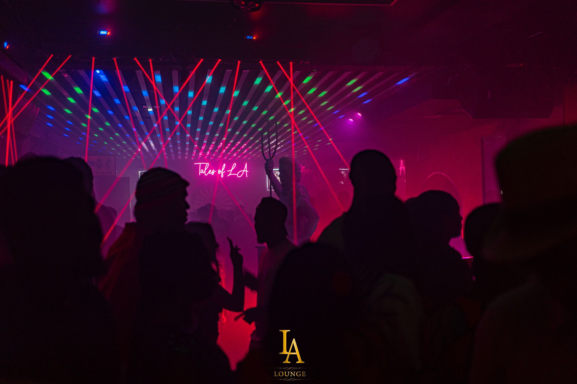 Vibrant LA Lounge venue with colorful lasers, ideal for nightlife events and celebrations.