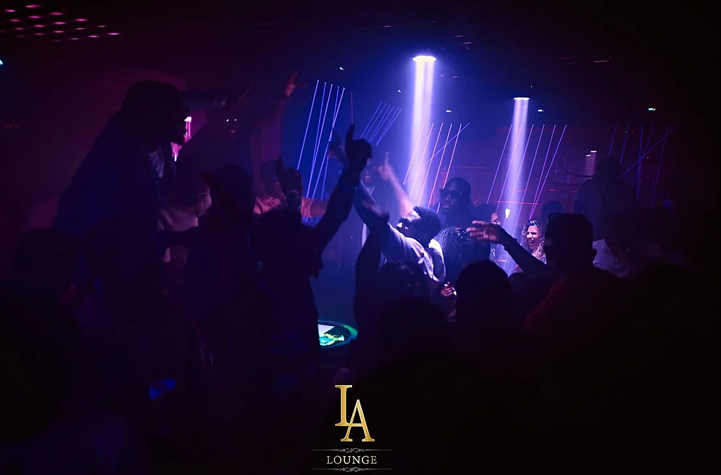 Vibrant LA Lounge nightlife with colorful lasers for immersive events and celebrations.