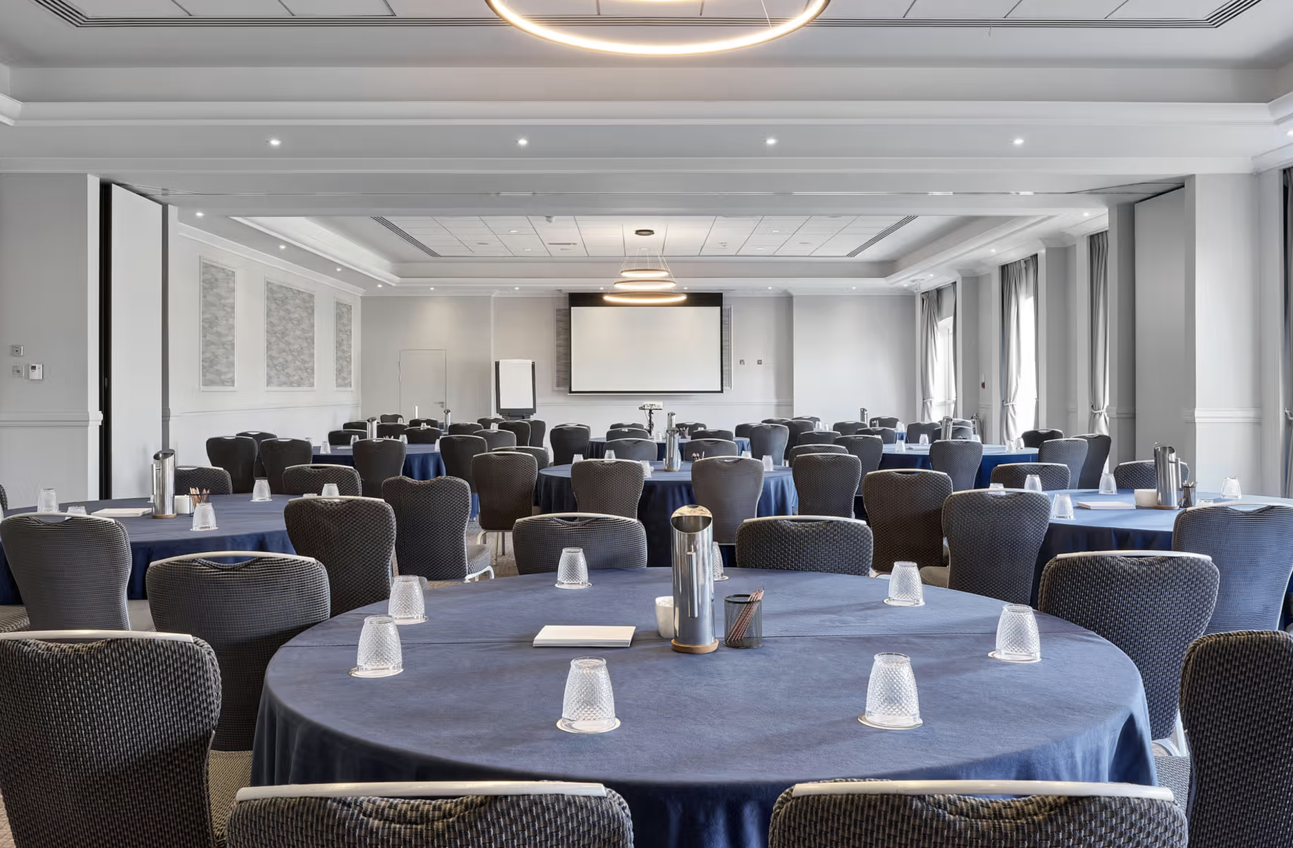 Thorpe Suite meeting room with navy tables, perfect for corporate events and presentations.