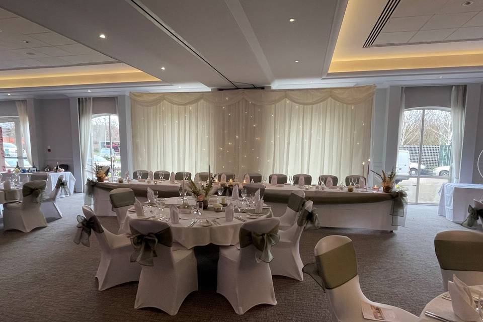 Thorpe Suite at Thorpe Park Hotel, elegant event space for weddings, with round tables.