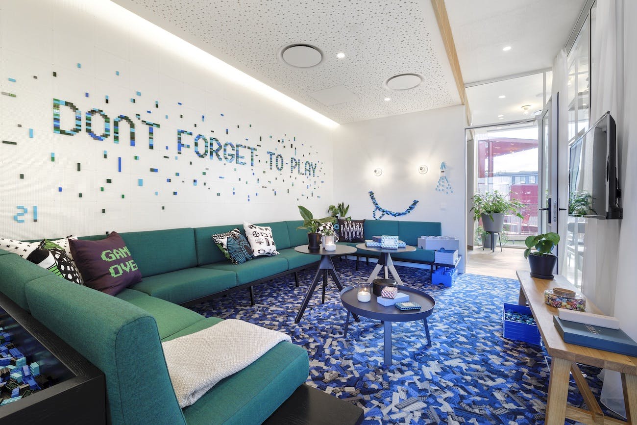 Modern conference room with vibrant decor for creative meetings and team-building activities.