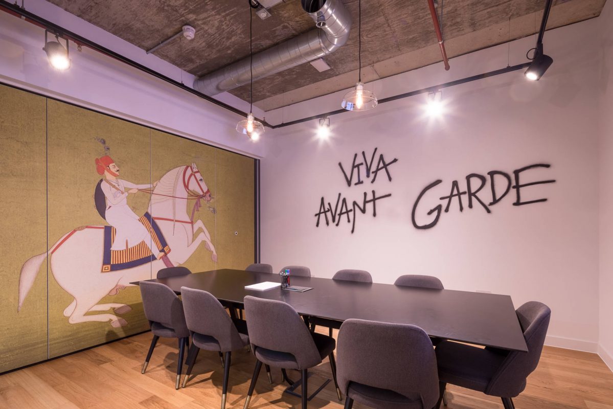 Stylish Mindspace meeting room with bold mural, ideal for workshops and creative meetings.