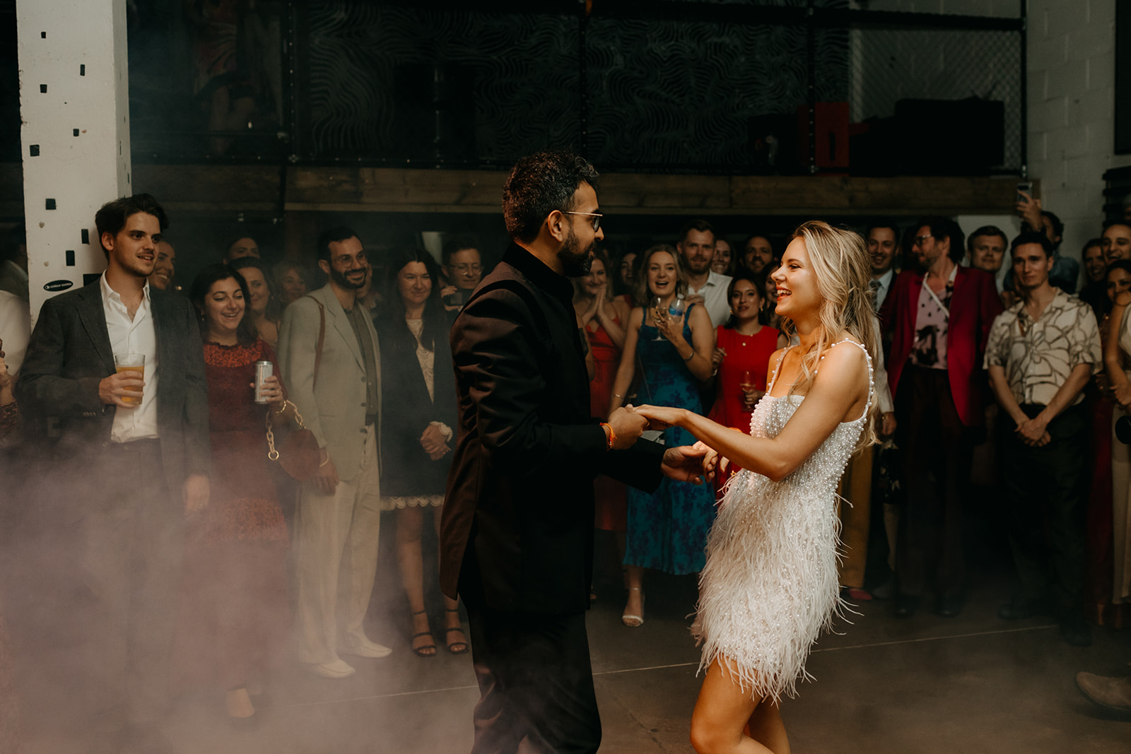 Elegant couple dancing at 90 Live event in Hackney Wick, vibrant atmosphere and memorable experiences.