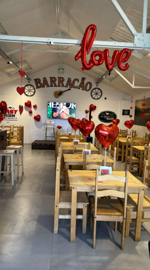 Romantic venue with heart-shaped balloons for Valentine's Day celebration.