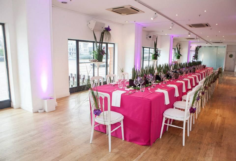 Elegant event space in OXO2 with pink tablecloths for corporate meetings and celebrations.