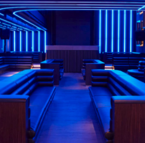 Modern BoTree Ballroom with blue lighting, perfect for networking events and gatherings.