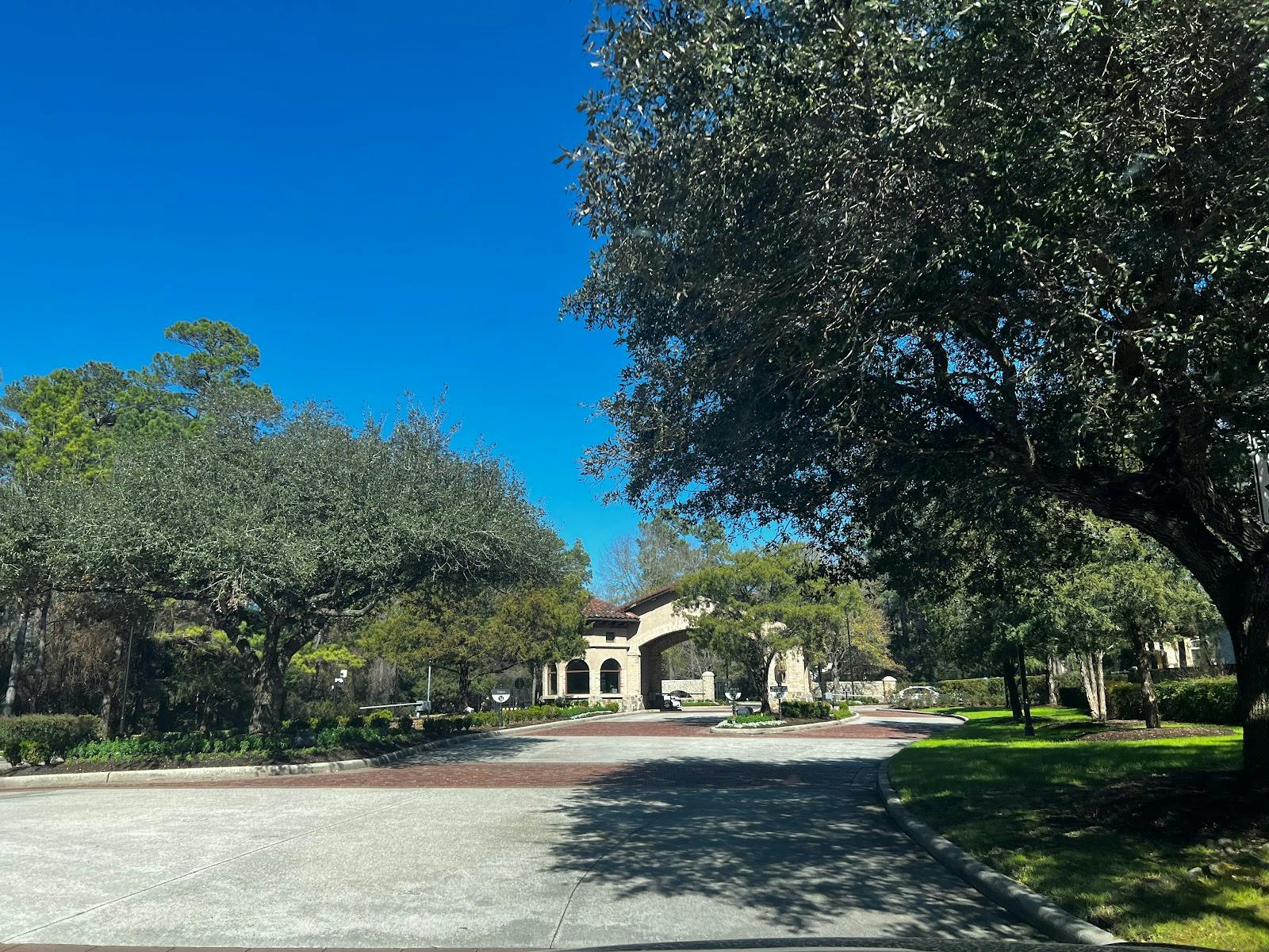 Nicklaus Clubhouse entrance surrounded by greenery, ideal for corporate retreats and social events.