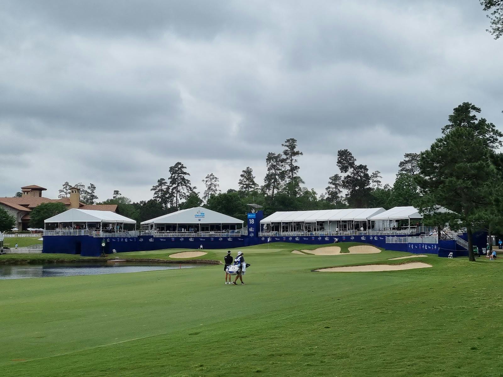 Elegant outdoor event setup at Nicklaus Clubhouse with white tents on a golf course.