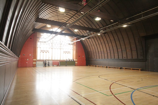 Spacious Sports Hall with arched ceiling, perfect for events and gatherings.