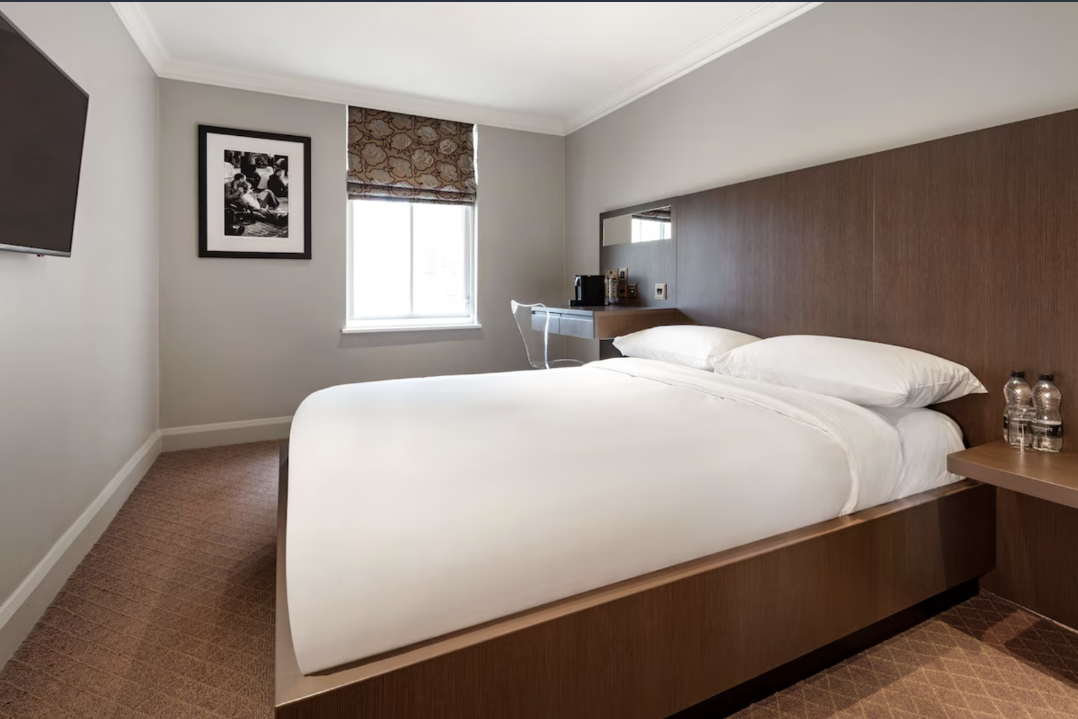 Radisson Blu Hotel London Bloomsbury bedroom with modern decor for business events.