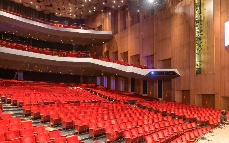 Concert hall in Jones Hall with tiered red seating for events and performances.