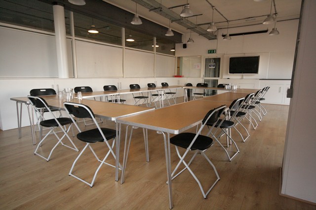 Conference Room at The Harrow Club with large table, ideal for workshops and meetings.