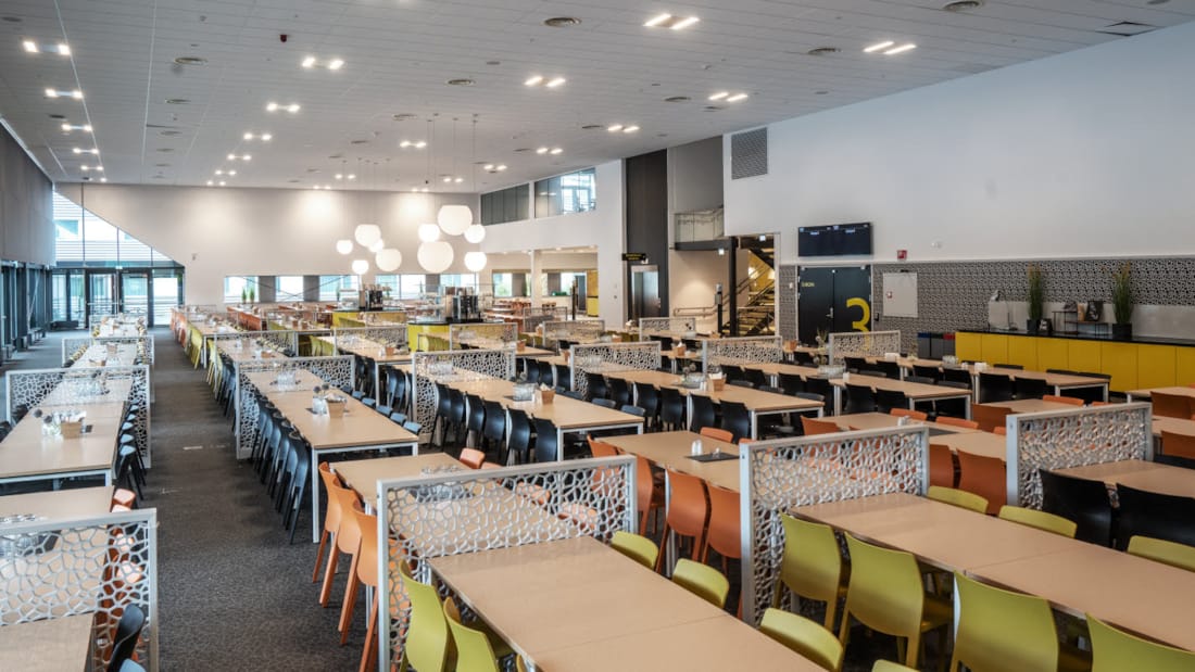 Spacious dining area at Clarion Hotel® The Hub, ideal for events and networking.