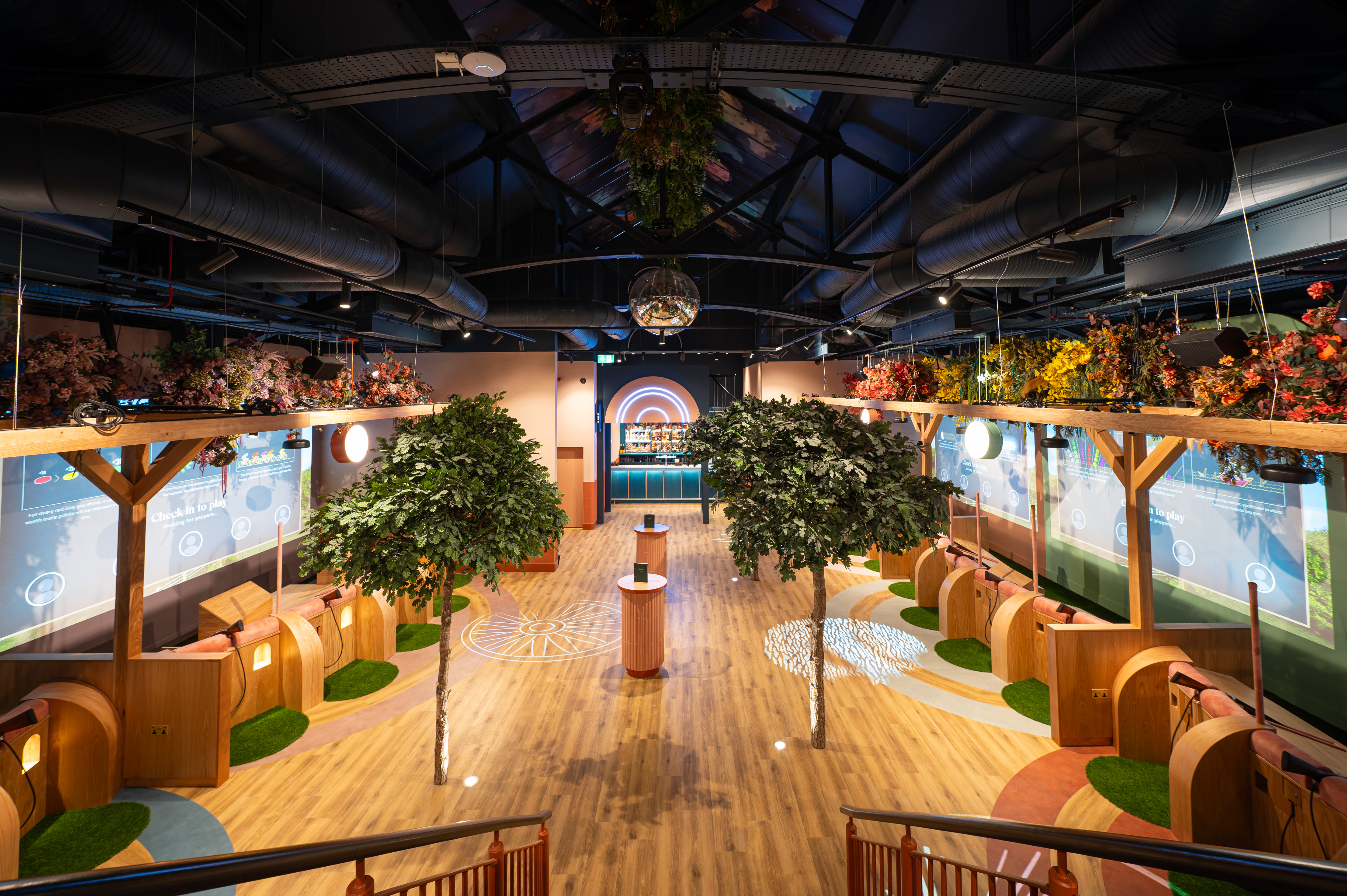 Vibrant Clays Arcade event space in Birmingham with greenery, ideal for meetings and networking.