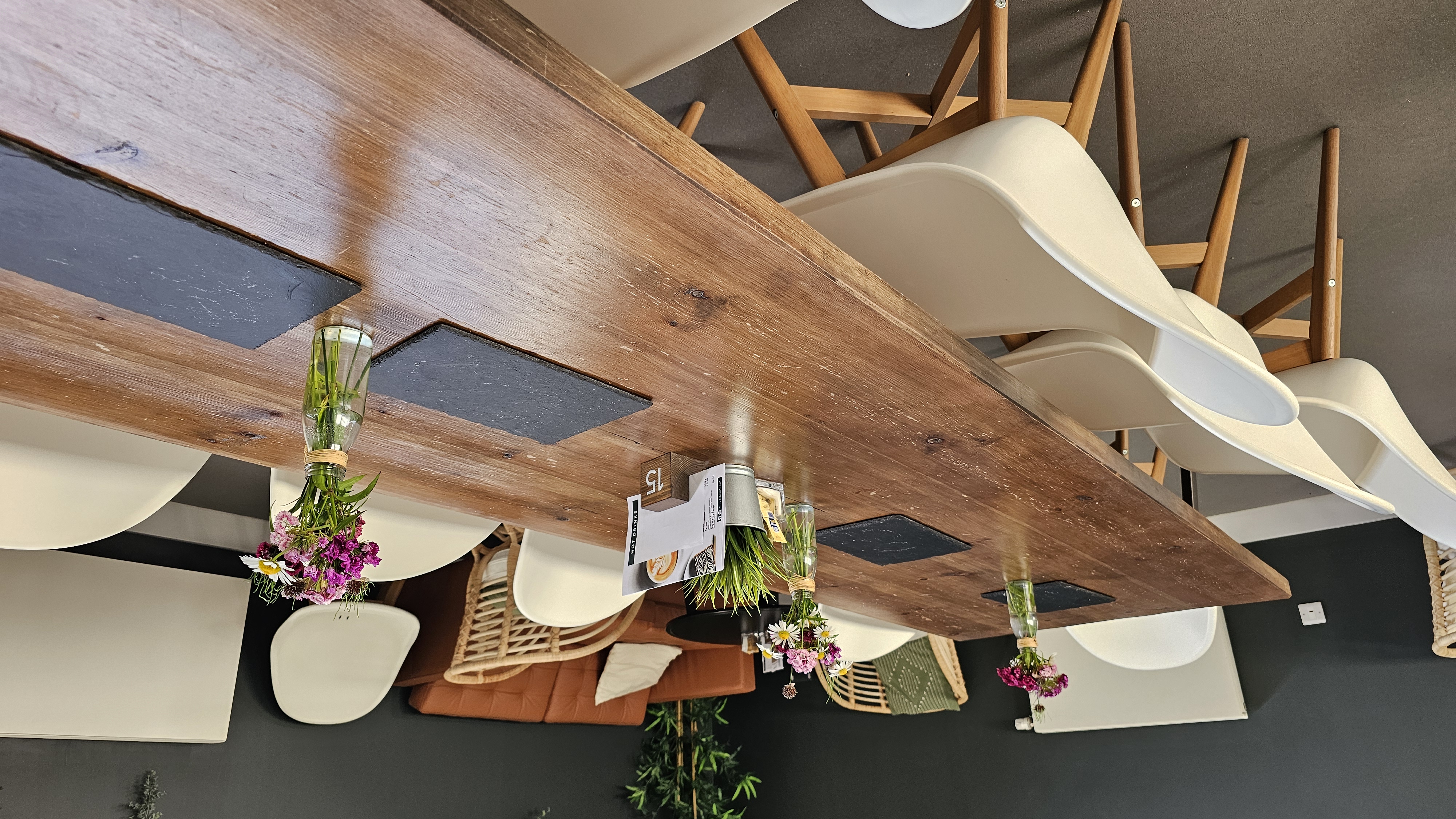 Stylish Riverside Conferencing Lower Lounge for meetings, featuring a wooden table and modern chairs.